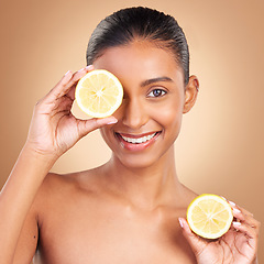 Image showing Skincare, woman portrait and lemon for health, wellness and beauty of a young model with happiness. Studio, smile and healthy fruit with vitamin c and fruits nutrition for facial and dermatology