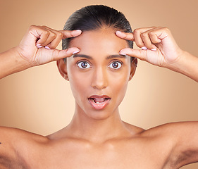 Image showing Beauty, surprise portrait and woman forehead wrinkles with a female squeeze face with shock. Isolated, studio background and cosmetic botox change of a model holding clean skin for plastic surgery