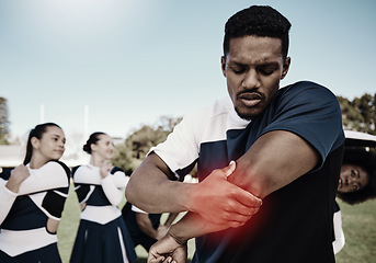 Image showing Cheerleader, sports or man with elbow pain, injury or accident on field in game or training match. Red glow, fitness or cheerleading male athlete with a medical emergency, joint or muscle sprain