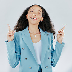 Image showing Business woman, portrait smile and pointing on mockup for advertising or marketing against a white studio background. Happy isolated female model with finger gesture or point for product placement