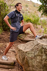 Image showing Stretching, fitness and man in forest for running, training or outdoor exercise goals, challenge and sports in nature. Young athlete with muscle warmup for runner cardio workout in woods or mountains