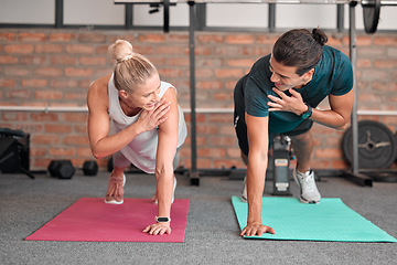 Image showing Fitness, push up and woman with partner, personal trainer or gym coach for support, teamwork and muscle goals. Athlete, sports and couple of friends in strong workout, exercise or training together