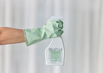 Image showing Hands, gloves and housekeeping with detergent spray bottle for spring cleaning, disinfection or dirt removal at home. Hand of cleaner holding sanitizer and rubber glove for clean hygiene or disinfect