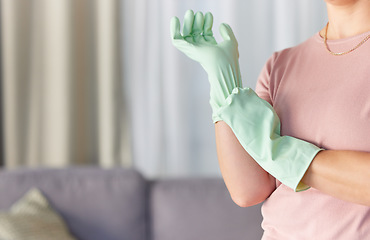 Image showing Woman, hands and gloves in housekeeping preparation for cleaning, dirt removal or disinfection in living room at home. Hand of cleaner ready to start spring clean service for safety with rubber glove