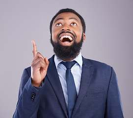 Image showing Wow, pointing and promotion with a business black man in studio on a gray background for motivation. Winner, hand gesture and announcement with a corporate male employee celebrating success