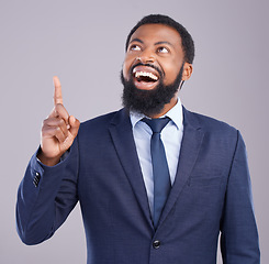 Image showing Wow, pointing and announcement with a business black man in studio on a gray background for motivation. Winner, hand gesture and promotion with a corporate male employee celebrating success