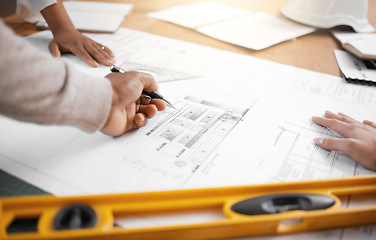 Image showing Hands, collaboration and planning with an architecture team working in their office on design from above. Teamwork, construction or blueprint with an architect, designer and engineer at work together