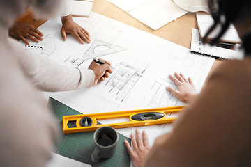 Image showing Hands, collaboration and construction with a building team working in their office on design from above. Teamwork, architecture or blueprint with an architect, designer and engineer at work together