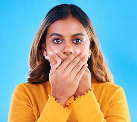 Image showing Shock, surprise and portrait of a woman in a studio with a omg, wtf or wow face expression. Amazed, shocked and female model posing with a surprised reaction to news isolated by a blue background.