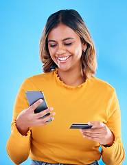 Image showing Happy woman, credit card and phone in studio for online shopping, digital fintech payment and customer money. Female model, ecommerce and mobile banking for finance, cash economy and sales promotion