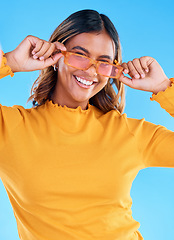 Image showing Fashion glasses, teen smile and happy woman with clothes, luxury designer brand or casual outfit style. Gen z summer aesthetic, teenager face portrait and young female model on blue background studio