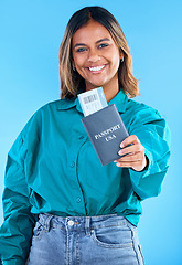 Image showing Portrait, passport and young woman isolated on blue background for USA travel opportunity, immigration or holiday. Identity documents, flight ticket and happy face of indian person or model in studio