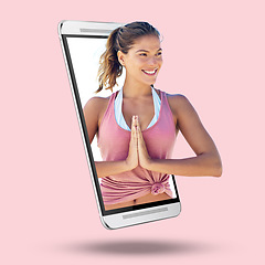 Image showing Woman, phone and screen on mockup for yoga, spiritual wellness or exercise against a studio background. Happy female yogi smiling in namaste pose on mobile smartphone display for mental wellness