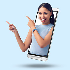 Image showing Woman, phone and screen on mockup pointing for product placement against studio background. Portrait of happy female showing finger gesture or point for marketing or advertising on smartphone display