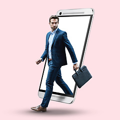 Image showing Double exposure, walking and a businessman with a phone isolated on a studio background. Looking, serious and a corporate executive employee with a briefcase stepping out of a cellphone on a backdrop