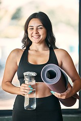 Image showing Yoga mat, portrait and woman with water bottle for fitness in gym, health or wellness workout. Pilates, smile and happy female yogi with liquid for hydration and rug to start exercise or meditation.