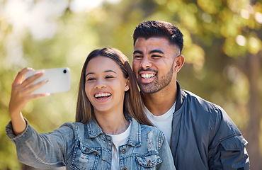 Image showing Couple, outdoor and selfie with a smile for love, care and happiness together in summer. Young man and woman at nature park for a profile picture on a happy and romantic date or vacation to relax