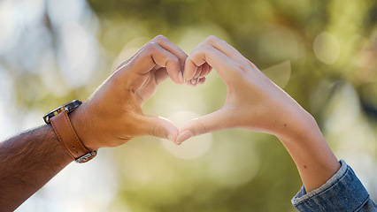 Image showing Couple, heart and hands in park of love, date or marriage commitment together in garden. Closeup man, woman and finger shape of care in relationship, support and trust of hope, freedom and emoji sign