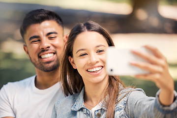 Image showing Outdoor, couple and smile with a selfie for love, care and happiness together in summer. Young man and woman at nature park for a profile picture on a happy and romantic date or vacation to relax