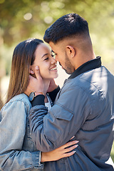 Image showing Smile, outdoor and couple with love, care and happiness together in summer. Young man and woman happy face at nature park for affection or kiss on a romantic date, holiday or vacation to relax