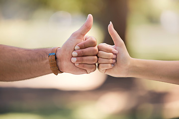 Image showing Thumbs up, fist bump and people with outdoor teamwork, support and collaboration mission or agreement. Man, woman partner or couple of friends with like, deal and success hands sign, power and park