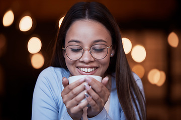 Image showing Smile, cup and a woman drinking coffee at night while working late in a dark office on a deadline. Happy, mug and an attractive young female smelling the aroma or scent from a fresh mug of caffeine