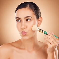 Image showing Beauty, cosmetics and makeup, woman with brush on face, aesthetic brown background and studio. Skincare, salon facial and luxury spa cosmetic product application for glowing skin on elegant model.