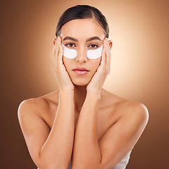 Image showing Woman beauty, face portrait and eye patch for studio dermatology, spa healthcare or cosmetics routine. Skincare, facial collagen product or female model with hyaluronic acid mask on brown background