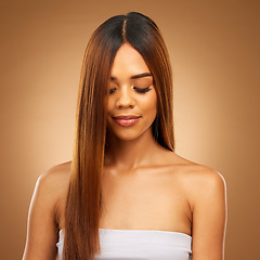 Image showing Hair care, straight and beauty of woman in studio for growth and color shine or healthy texture. Aesthetic female face for natural makeup cosmetics, hairdresser or salon mockup on a brown background