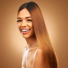 Image showing Portrait, beauty and hair care of woman in studio for growth and color shine or healthy texture. Aesthetic female happy face for haircare, natural makeup and hairdresser or salon on brown background