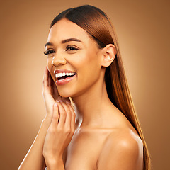 Image showing Woman with hand on face, smile and skincare with bronze glow and luxury salon treatment on brown background. Beauty, makeup and skin care cosmetics, hispanic model with straight hair style in studio.