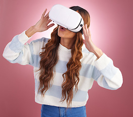 Image showing VR, metaverse and innovation with a woman using a headset to access the online world of gaming. AI, 3D and Virtual reality with a female gamer in studio on a pink background using future technology