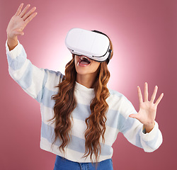 Image showing VR, metaverse and gaming with a woman using a headset to access the online world of innovation. AI, 3D and virtual reality with a female gamer in studio on a pink background using future technology