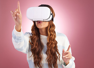 Image showing Virtual reality, metaverse and AI with a woman a headset to access the online world of gaming. Innovation, 3D or VR and a female gamer in studio on a pink background with future technology