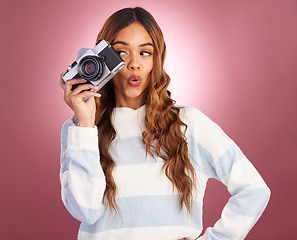 Image showing Camera, woman and happy photographer in studio for fun, posing and gen z retro aesthetic on pink background. Lens, photographer and girl posing for picture, photo or photograph on isolated mockup