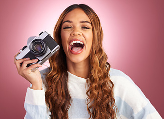 Image showing Photography, portrait of woman with camera and smile on studio background in creative travel or fashion shoot. Art, professional and happy hispanic photographer, hobby or career in photos or pictures