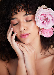 Image showing Flowers, rest and face of woman with makeup, cosmetics and beauty for wellness, glamour and glow in studio. Salon aesthetic, spa and girl with closed eyes for natural, skincare and facial treatment