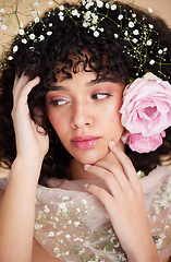 Image showing Flowers, beauty and face of woman with cosmetics, makeup and hair care for wellness, glamour and glow. Spring aesthetic, spa and girl with fabric for natural, skincare and facial treatment in studio