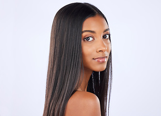Image showing Woman, portrait and straight hair in salon treatment, keratin or glow against a white studio background. Serious isolated female model in self care for healthy hairstyle, haircare or beauty cosmetics