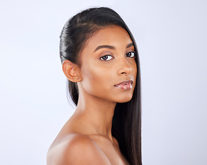 Image showing Indian woman, hair care or makeup in studio portrait for strong, healthy natural shine or wellness. Face of glowing young girl model, salon beauty or self care cosmetics grooming on white background