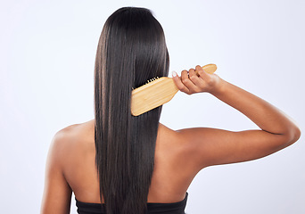 Image showing Woman brush hair, beauty with cosmetics, haircare with keratin treatment and back on studio background. Female with straight hairstyle and skin glow, Brazilian and cosmetic care, growth and strong