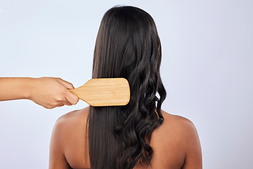 Image showing Back, woman or hair care brush in studio for beauty, self love or style treatment on white background. Hand, relaxing or young girl model with salon equipment in grooming routine on mockup space