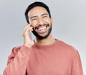 Image showing Young asian man, phone call and happy in studio for communication, networking and gray background. Student male model, smartphone and excited smile for chat, listening and conversation with happiness