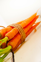 Image showing baby carrots bunch tied with rope