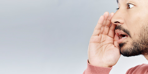 Image showing Whisper, secret and man in studio with gossip, sneaky and gesture on mockup against grey background. Hush, news and asian male sharing confidential, drama or mystery while posing with symbol isolated