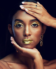 Image showing Indian woman, art makeup and studio portrait for beauty, wellness or celebration by black background. Model face, asian girl and dark aesthetic with gold lipstick, jewellery or cosmetic for a queen