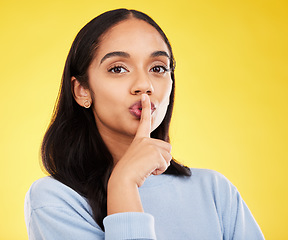 Image showing Secret, portrait and woman with finger on lips in studio, yellow background and privacy sign. Face of female model, silence and shush for quiet, gossip and whisper emoji for confidential mystery news