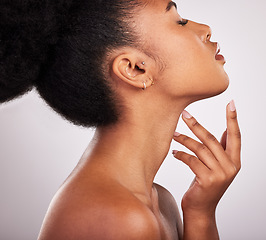 Image showing Skincare, cosmetics and profile of black woman with confidence, white background and beauty product. Health, dermatology and natural makeup, African model in studio for healthy skin care and wellness