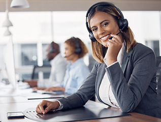 Image showing Call center woman, portrait and smile in office for customer support job, happiness or microphone at desk. Indian telemarketing consultant, desktop pc or happy crm with communication in workplace