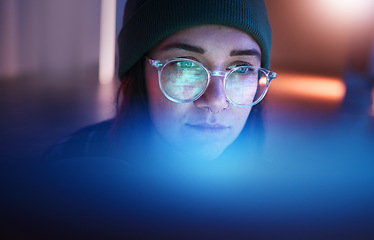 Image showing Cybersecurity, database and woman hacker working on a computer in the basement at night for phishing. Malware, password and ransomware with a female coder hacking a digital transformation network